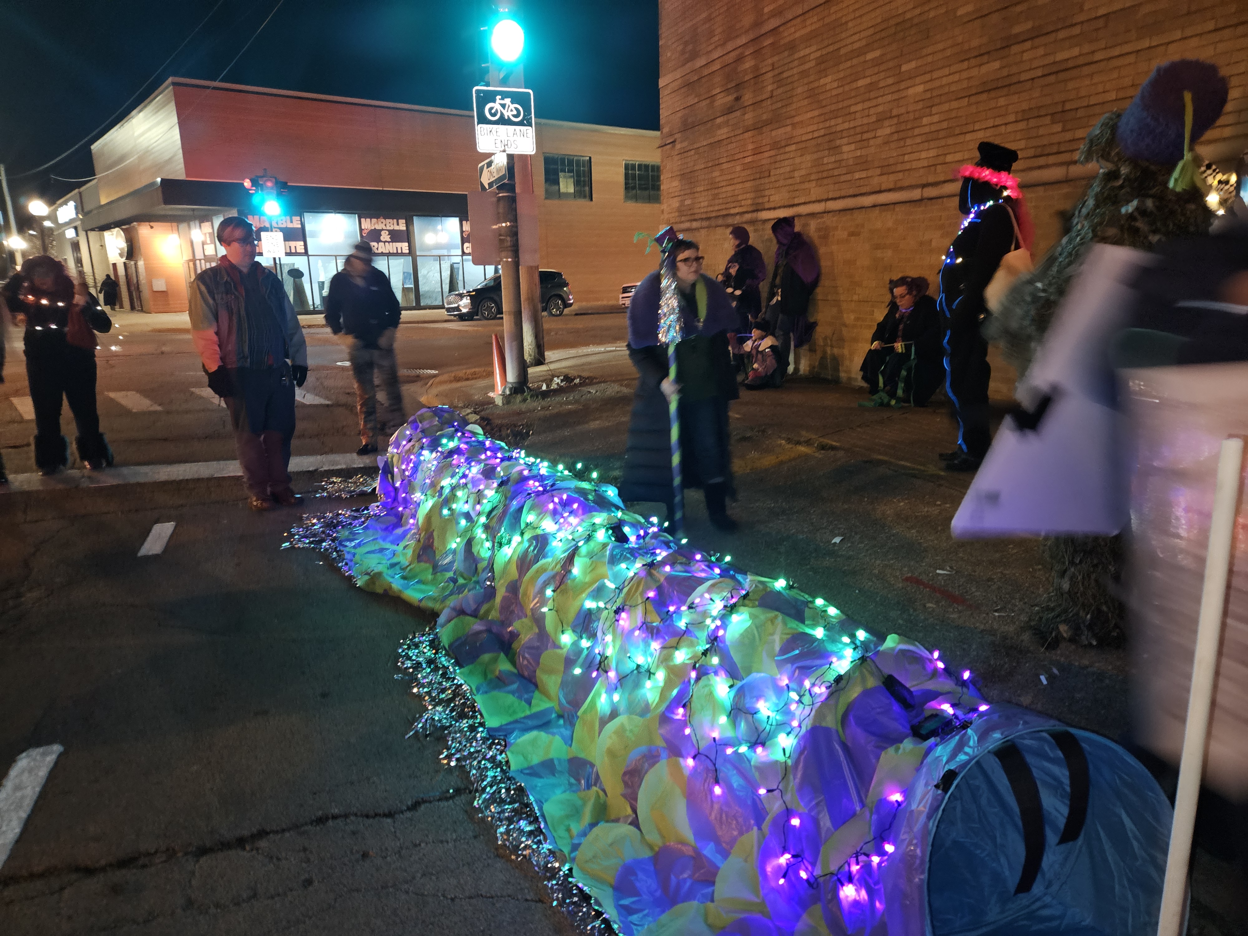 Kate leading her first janky vinyl dragon at the Champaign Parade of Lights